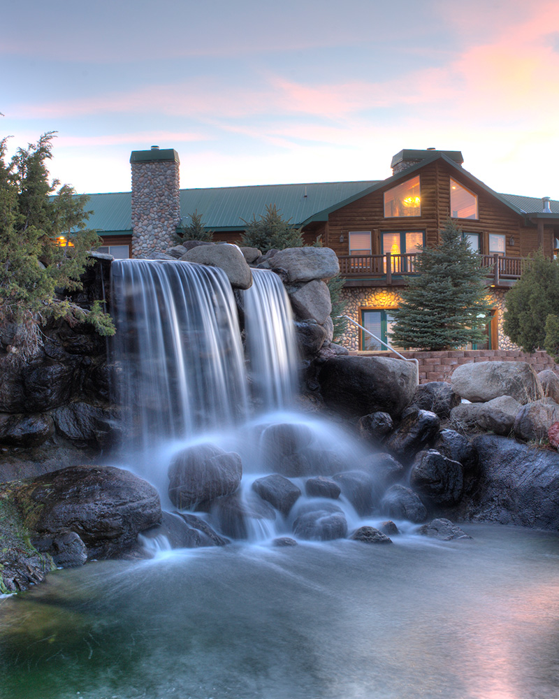 A waterfall and main campus at a Residential Program for Teens | Discovery Ranch South, a Residential Treatment Center for Girls and Teens Assigned Female at Birth