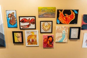 A wall full of student art at a residential program for teens | Discovery Ranch South, a Residential Treatment Center for Girls and Teens Assigned Female At Birth