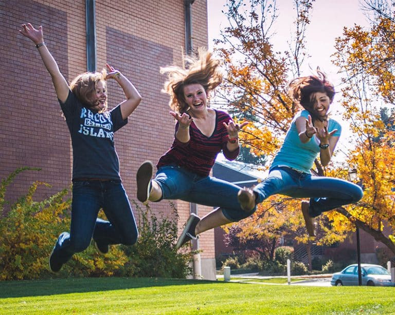 Teens jumping and having fun while attending residential treatment for girls and youth assigned female at birth | Discovery Ranch South