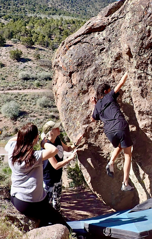 Part of identity development is trying new things, like this teen who is rock climbing as part of the adventure therapy program at Discovery Ranch South, a teen treatment program for girls and adolescents assigned female at birth