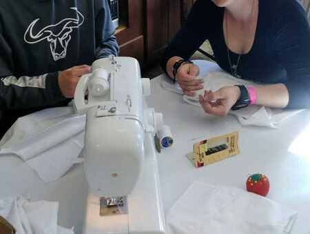 Teens practice social skills while learning how to sew during an activity at Discovery Ranch South, a residential treatment center for girls and teens assigned female at birth